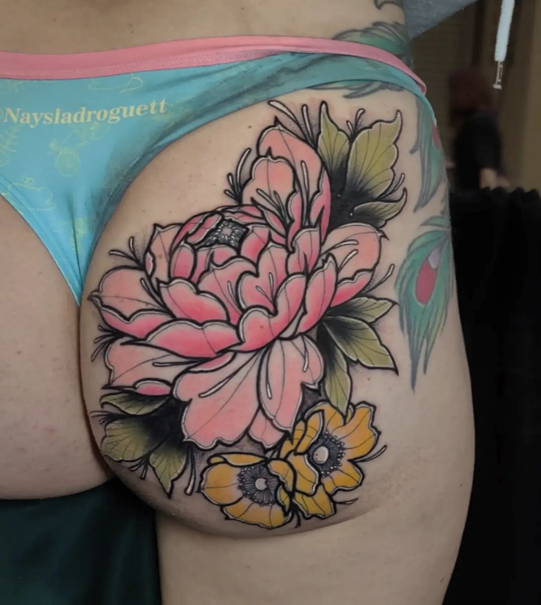 Pink peony and wildflowers, color hip tattoo